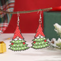 Wooden Christmas earrings with printed tree and snowman designs featuring geometric shapes