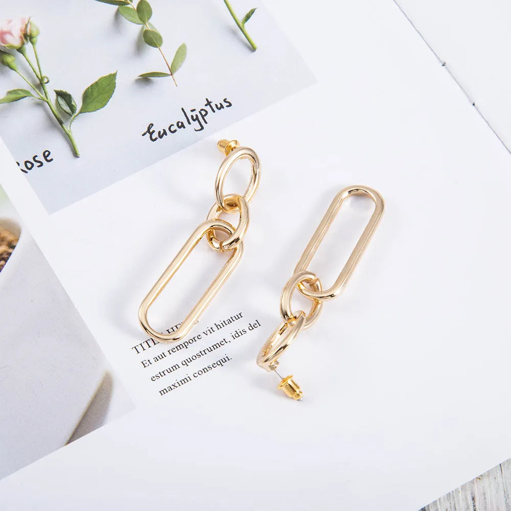 Geometric sterling silver needle hoop earrings with ring and line design details