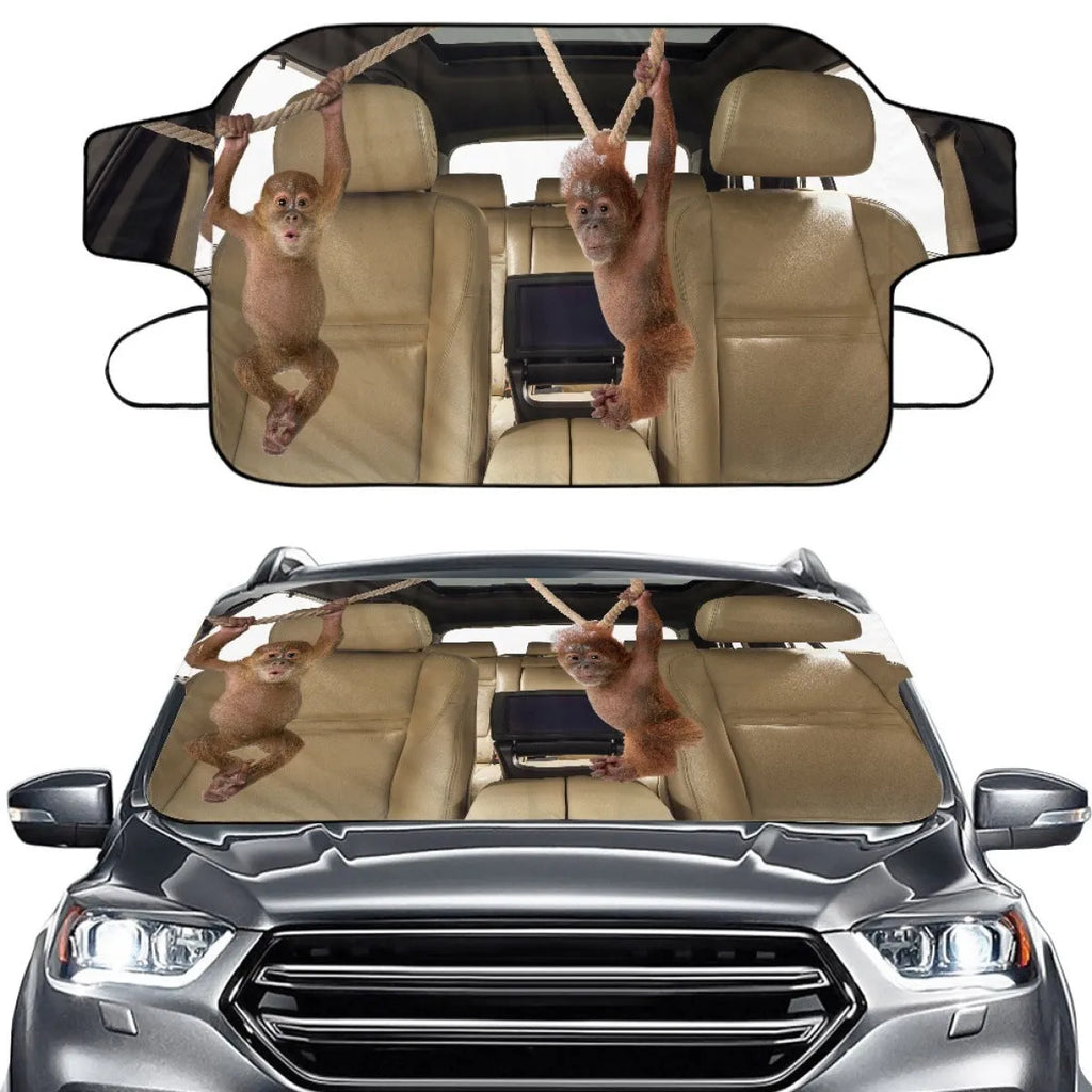 Car front snow protection cover made from silver aluminum foam fabric with black lanyard ties.