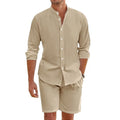 Man wearing a dark grey linen blend short sleeve shirt and matching drawstring shorts summer suit.