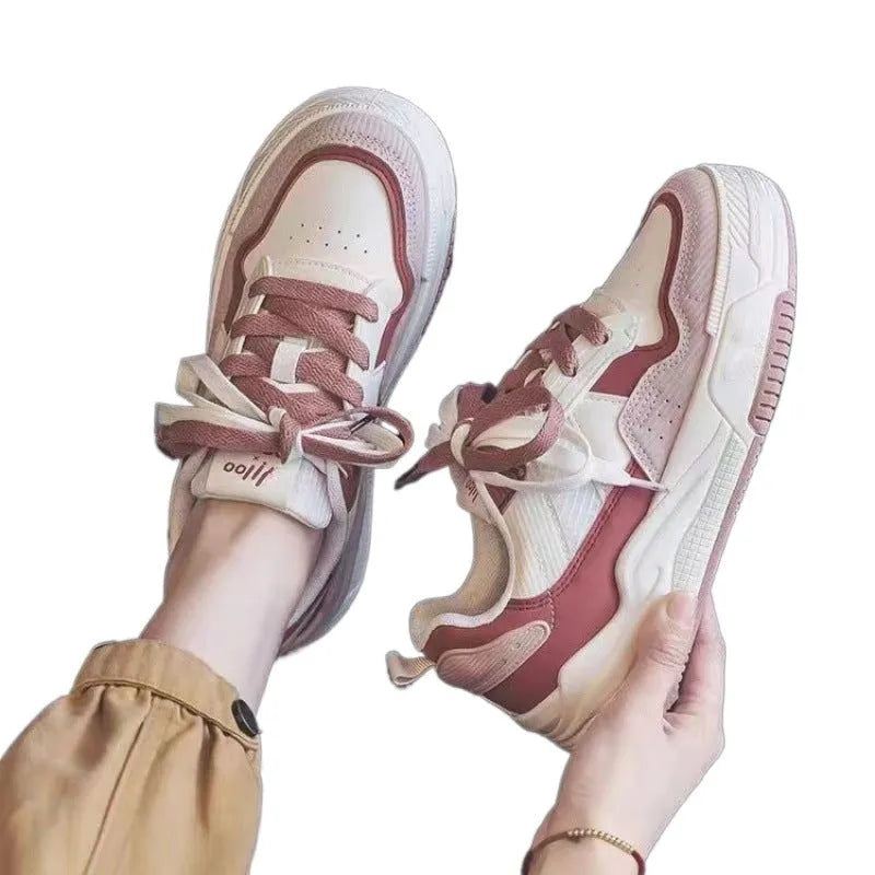 Women's pink and white low-top sneakers with a rubber sole, shown in sizes 35 to 40.