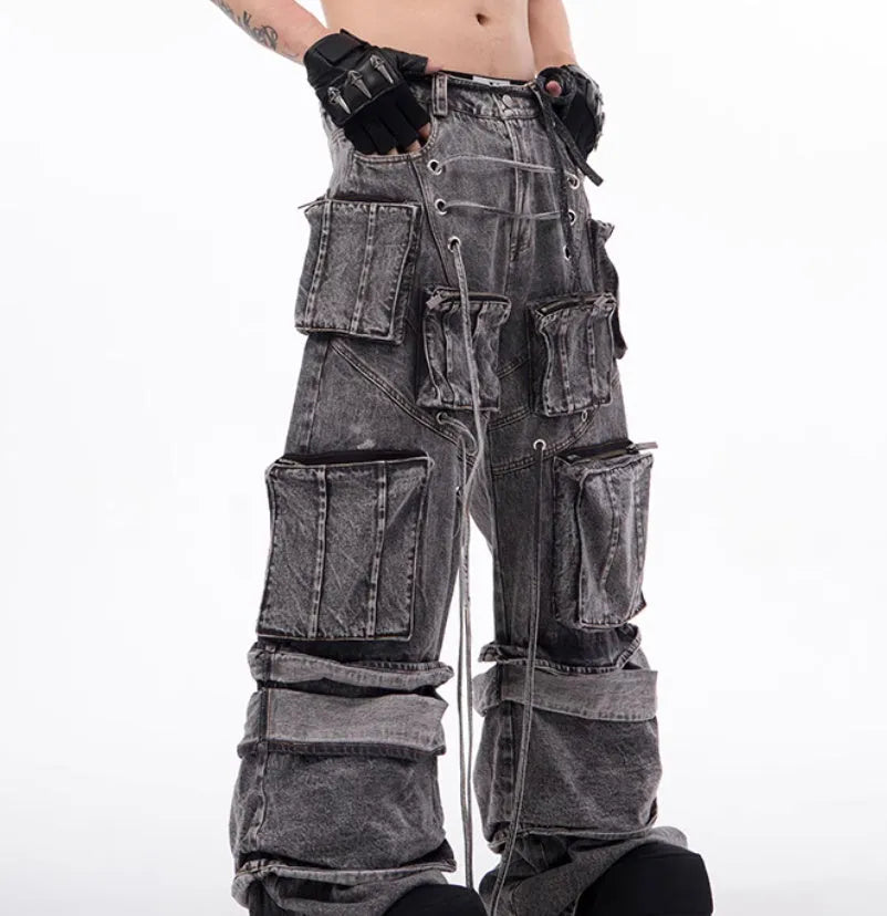 Grey American-style distressed denim overalls with rope stitching on cotton fabric.