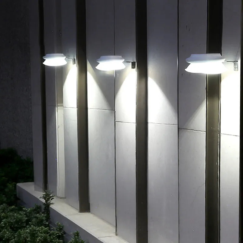 Solar-powered outdoor fence wall lamp in black or white shell with LED illumination for garden decoration