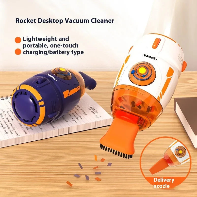 Blue USB rechargeable handheld desktop vacuum cleaner on a wooden desk next to a keyboard