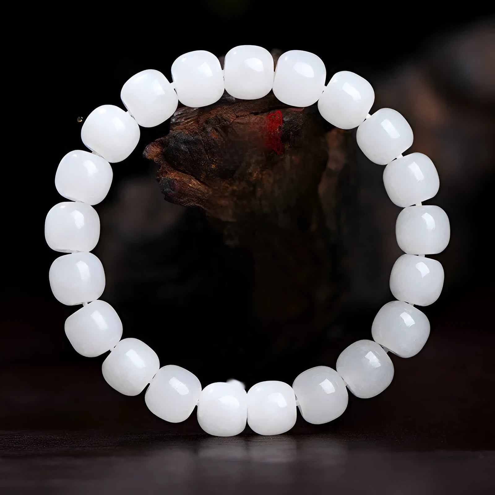 White Hetian jade barrel bead bracelet showing three bead size options on wrist