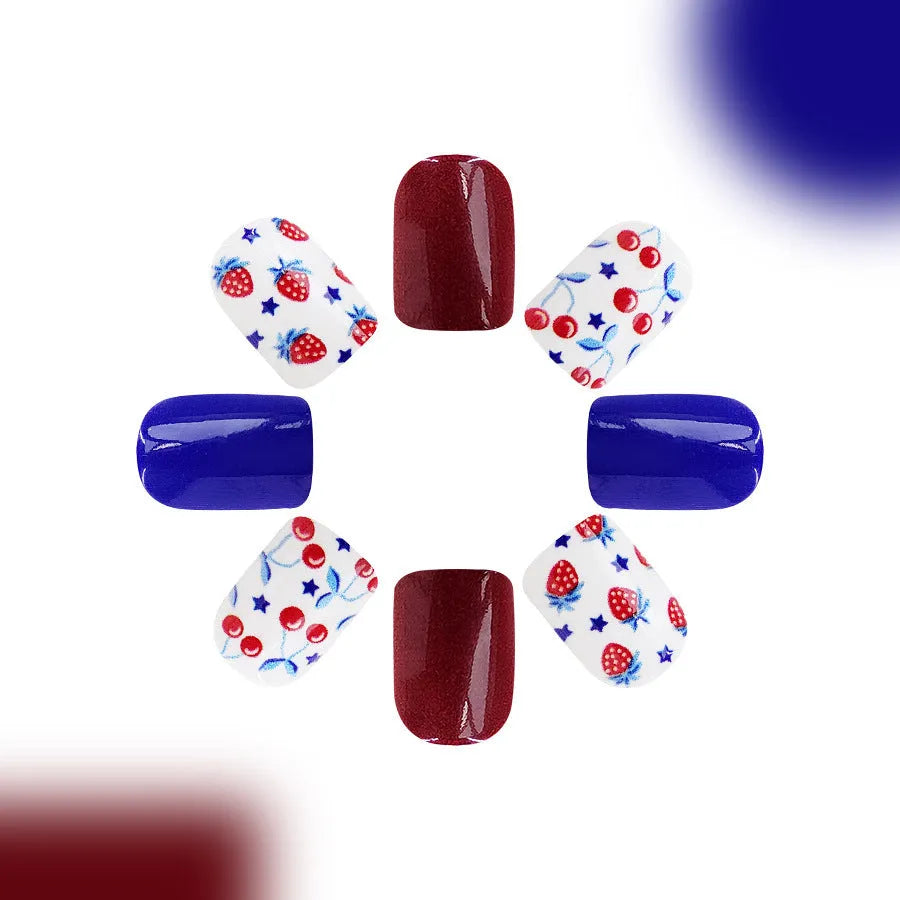 Short glossy red and blue nail stickers with strawberry and cherry patterns - 24 piece set