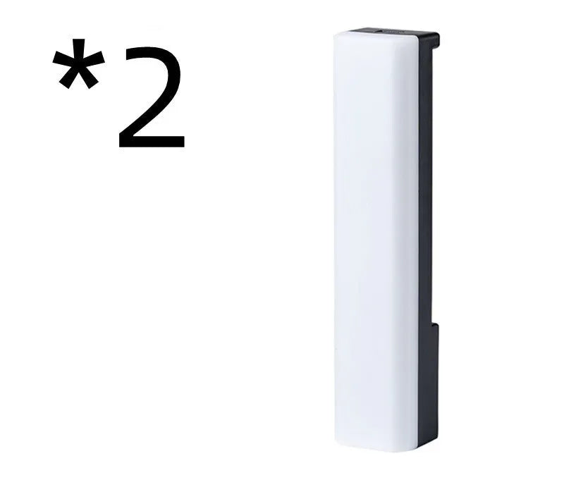 Black and white 3D RGB voice-activated music rhythm ambiance lamp on a table.