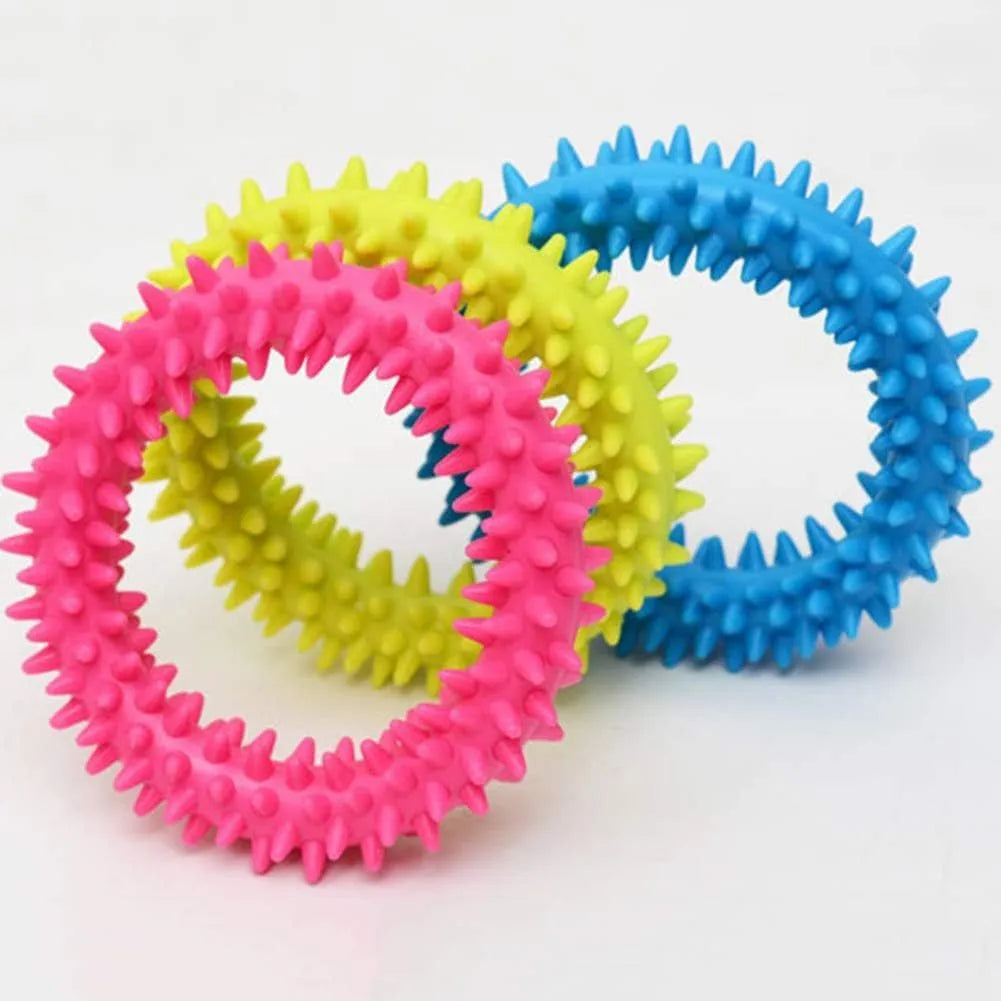Blue spiky circle ring dog chew toy made of TPR on a white background.