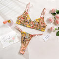 Women's floral design bikini underwear suit shown in multiple colours including skin, purple, and black.