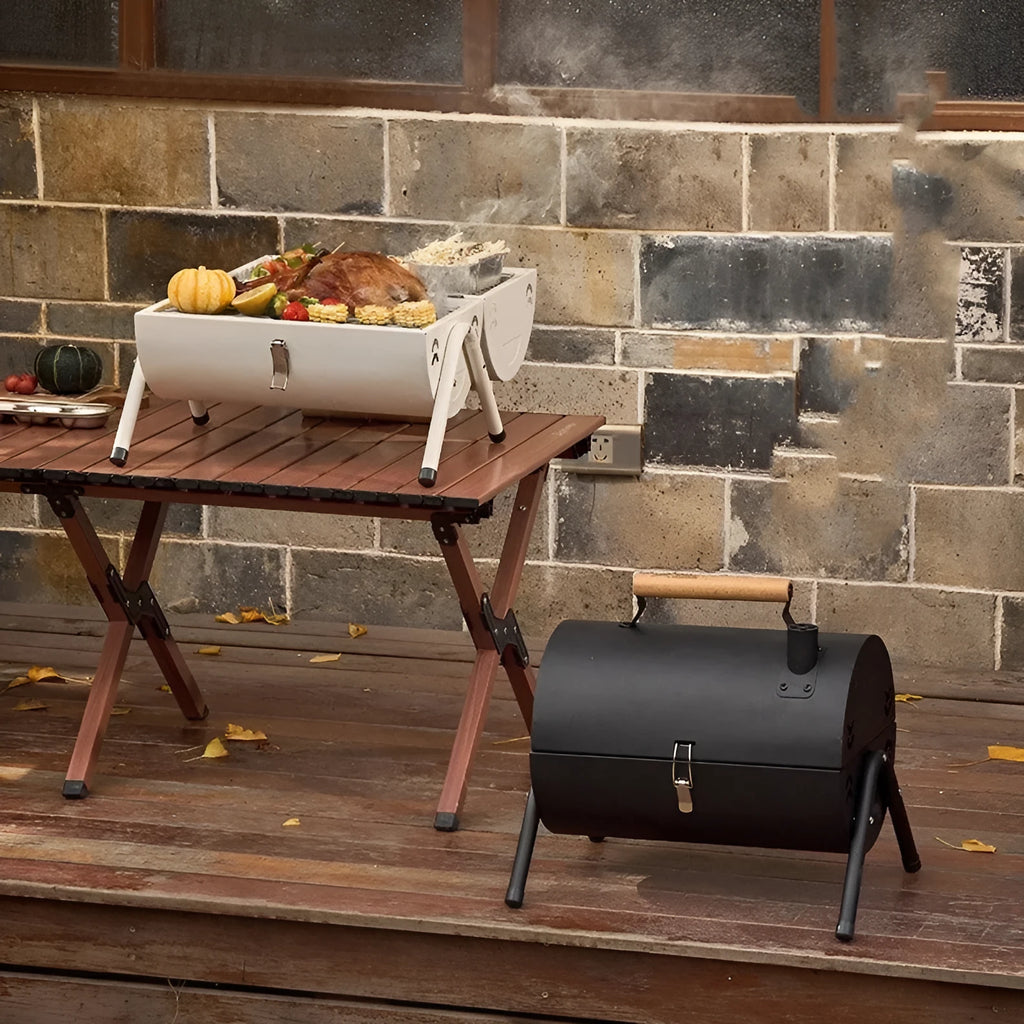 White round portable folding grill with detachable carbon tank for outdoor baking and frying