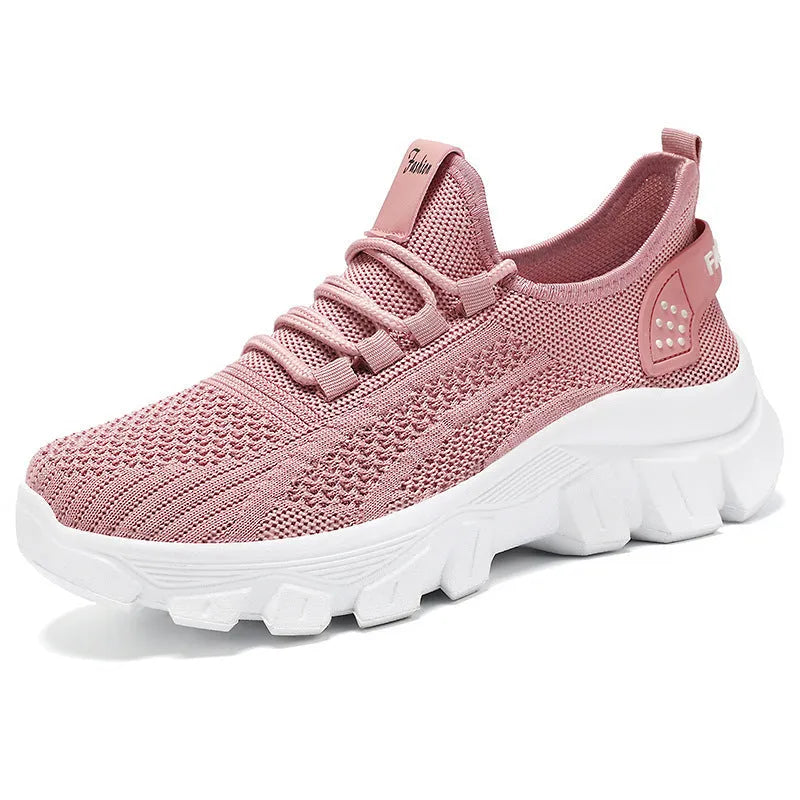 Women's white Flyknit sneaker with thick PVC sole and front lace-up design