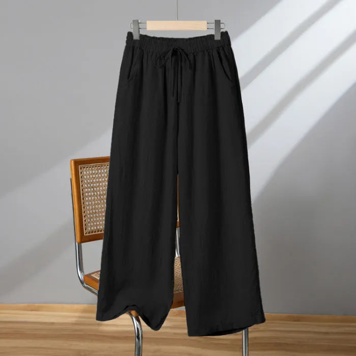 Women's straight-leg casual trousers in apricot colour with elastic waist and lace-up front detail.