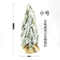 Small 24-inch desktop artificial Christmas tree with white snow sprayer effect and integrated coloured lights