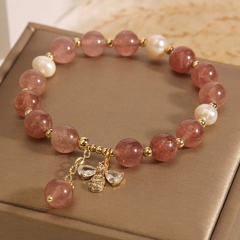 Women's strawberry quartz and freshwater pearl bracelet with zircon details and alloy charms