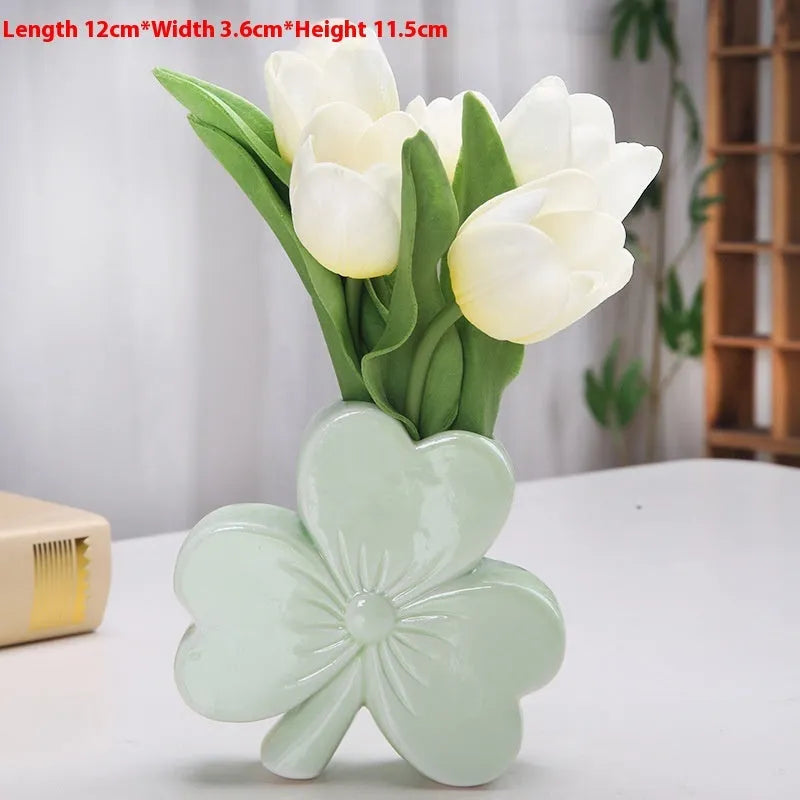 A white porcelain ceramic vase in European style for desktop decoration.