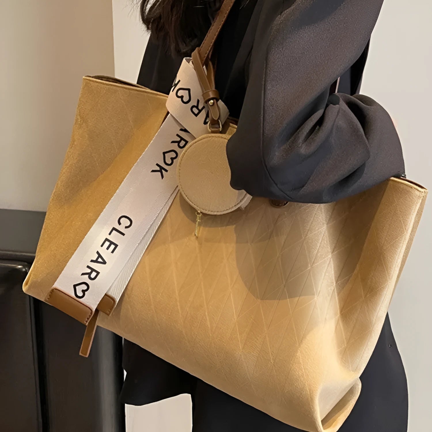 Large capacity polyester shoulder bag in green colour showing horizontal square shape and shoulder strap