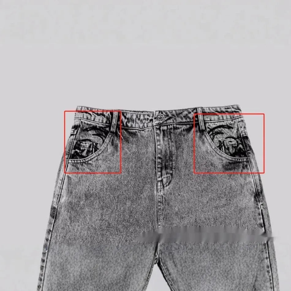 Grey loose straight-leg denim trousers showing mid-waist design on mannequin