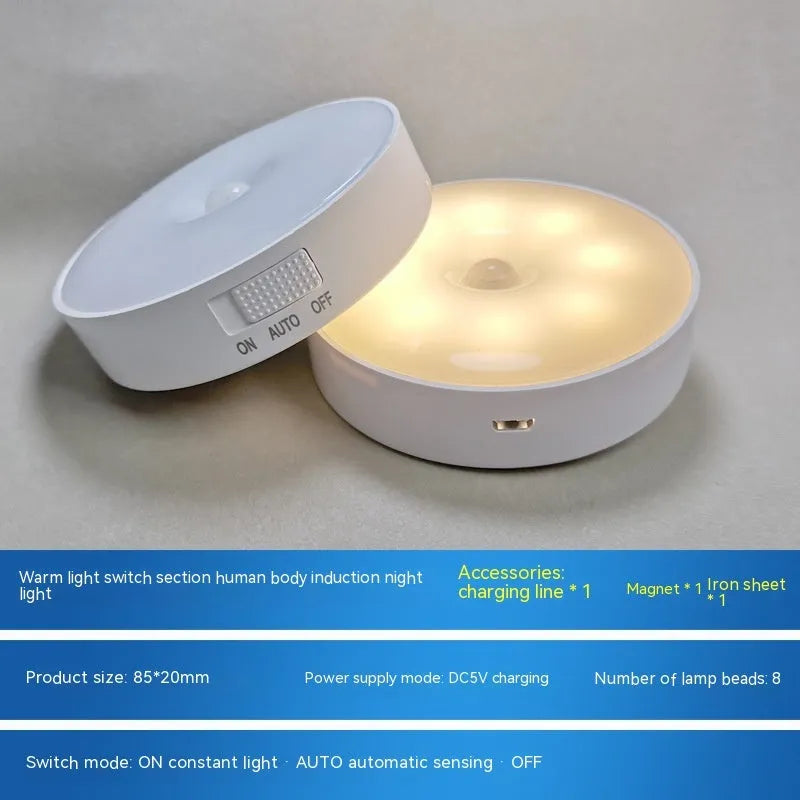 White motion sensor LED night light with USB charging port and adhesive backing