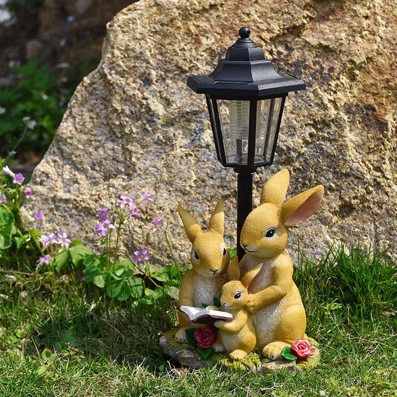 Solar powered decorative garden lamp with synthetic resin animal sculpture design