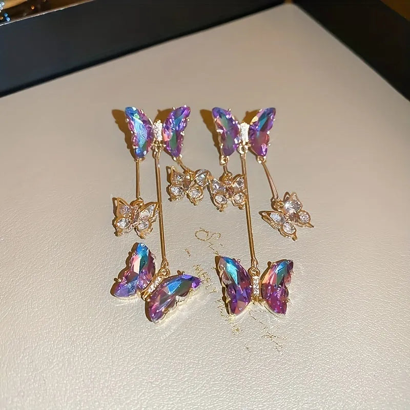 Silver needle finish blue purple butterfly and crystal flower drop tassel earrings for women.