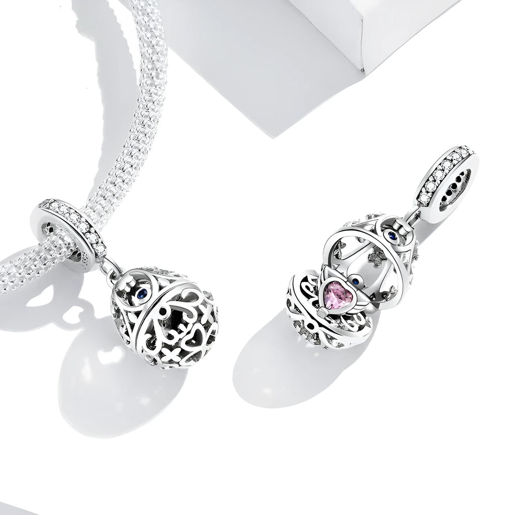 Silver electroplated loose bead pendant 2.3cm high 1cm wide on plain background