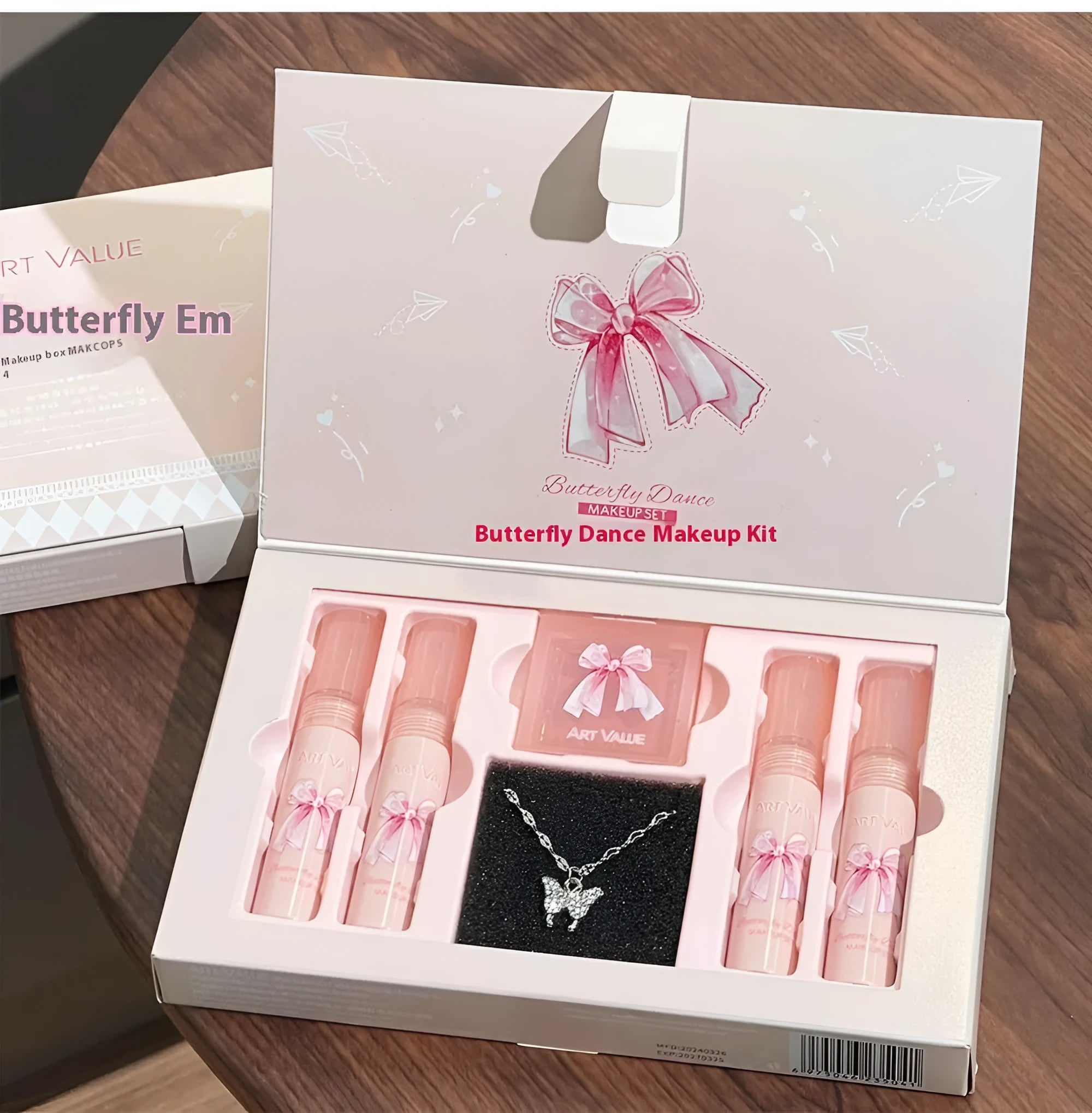 Butterfly Box Suite cosmetics set with four lip mud pots, powder blusher, and necklace in pink packaging