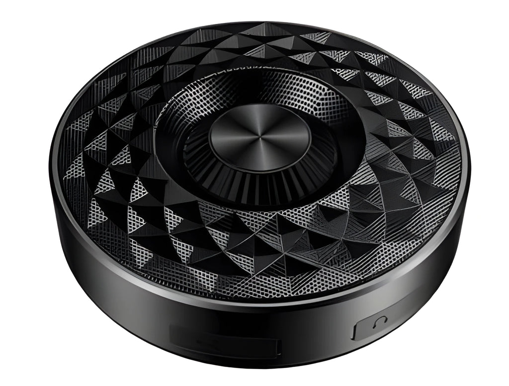 Compact black portable Bluetooth speaker on a table, showing its small size and design.