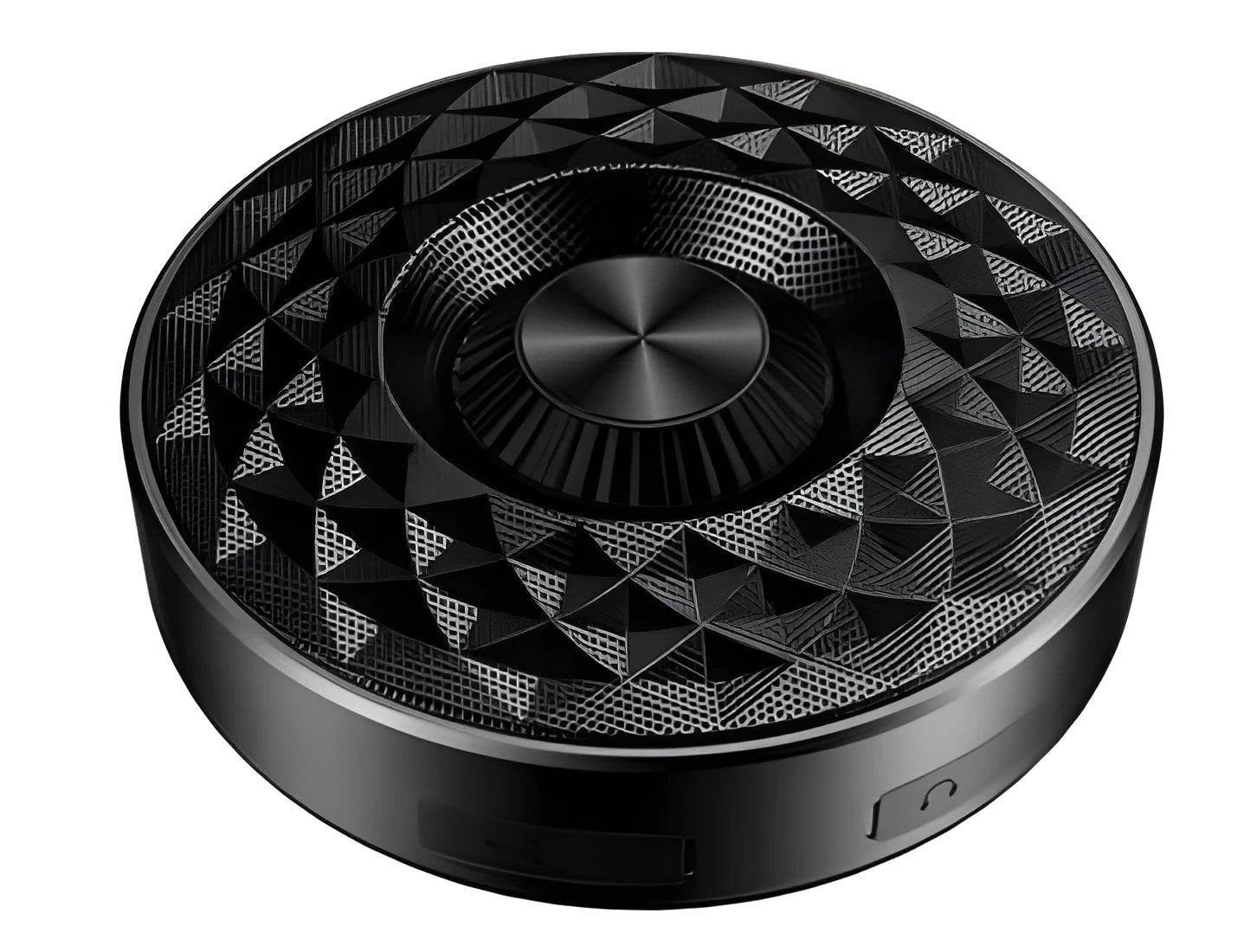 Compact black portable Bluetooth speaker on a table, showing its small size and design.
