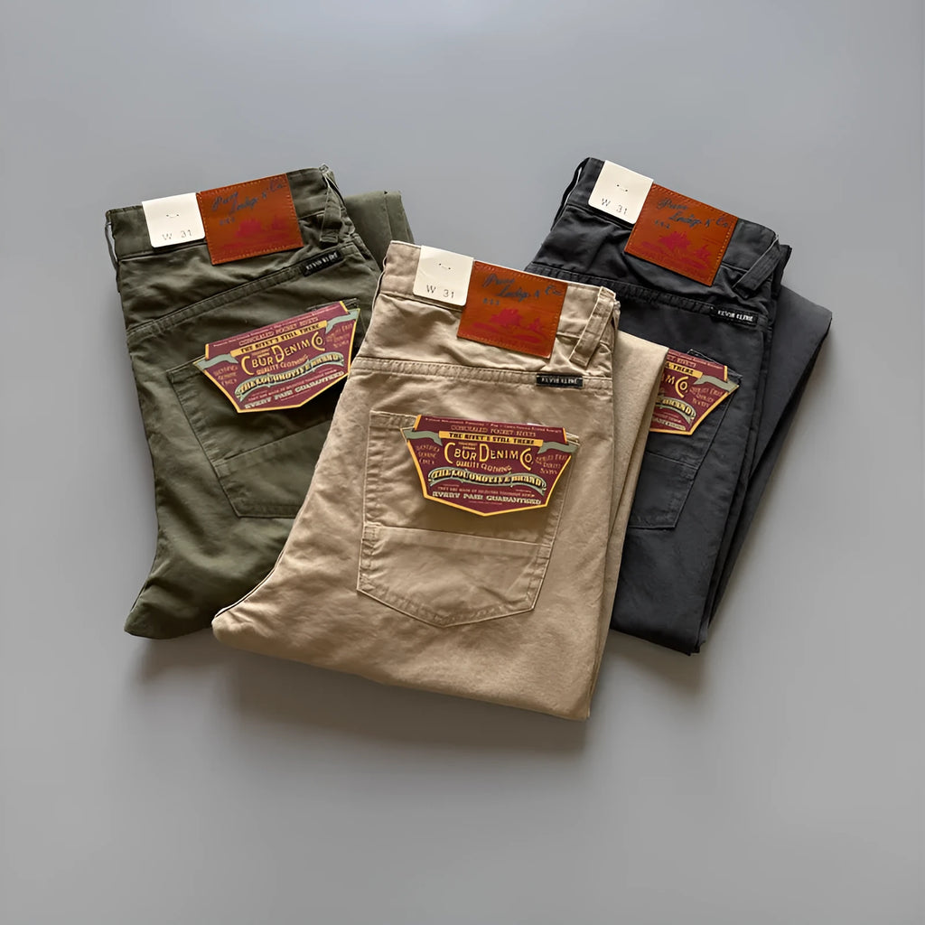 A pair of men's straight leg casual trousers in khaki colour on a mid-grey background.