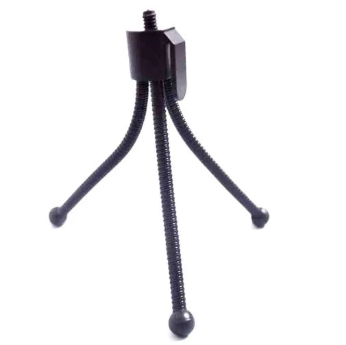 Small aluminium tripod with ball head collapsed to 110mm height next to mobile phone