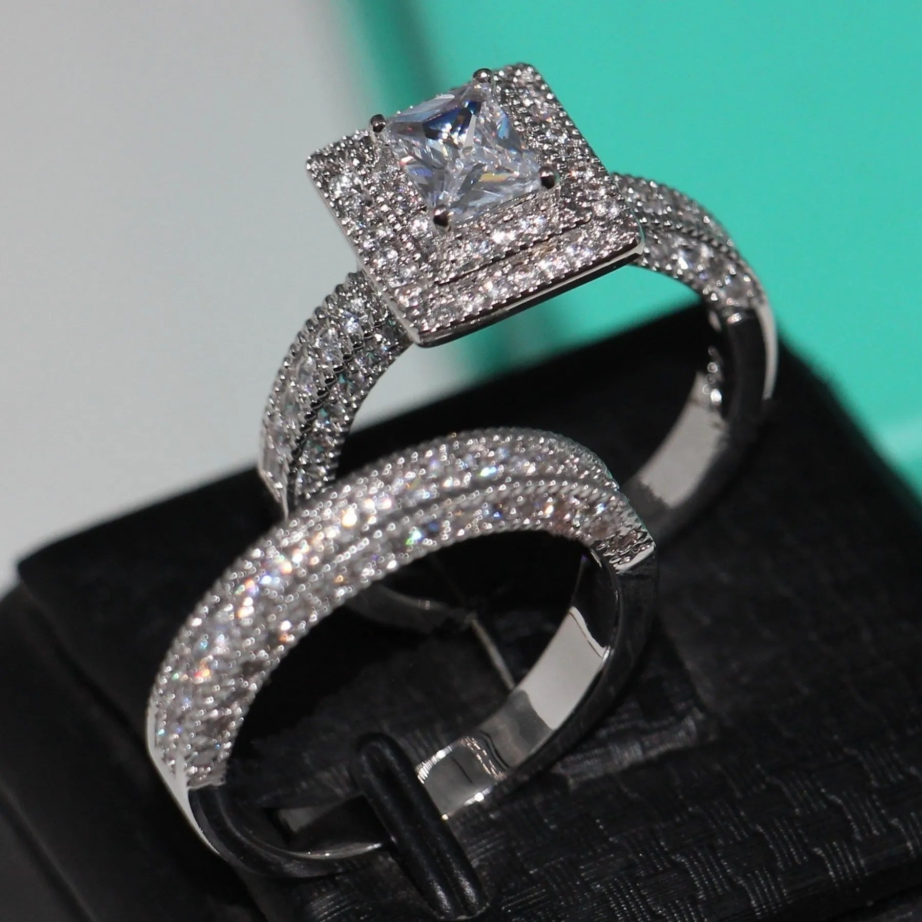 Silver zinc alloy double layer zircon ring on finger showing stacked design