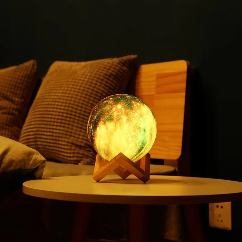 Spherical lunar night light on display, showing colour-changing LED glow with remote control.