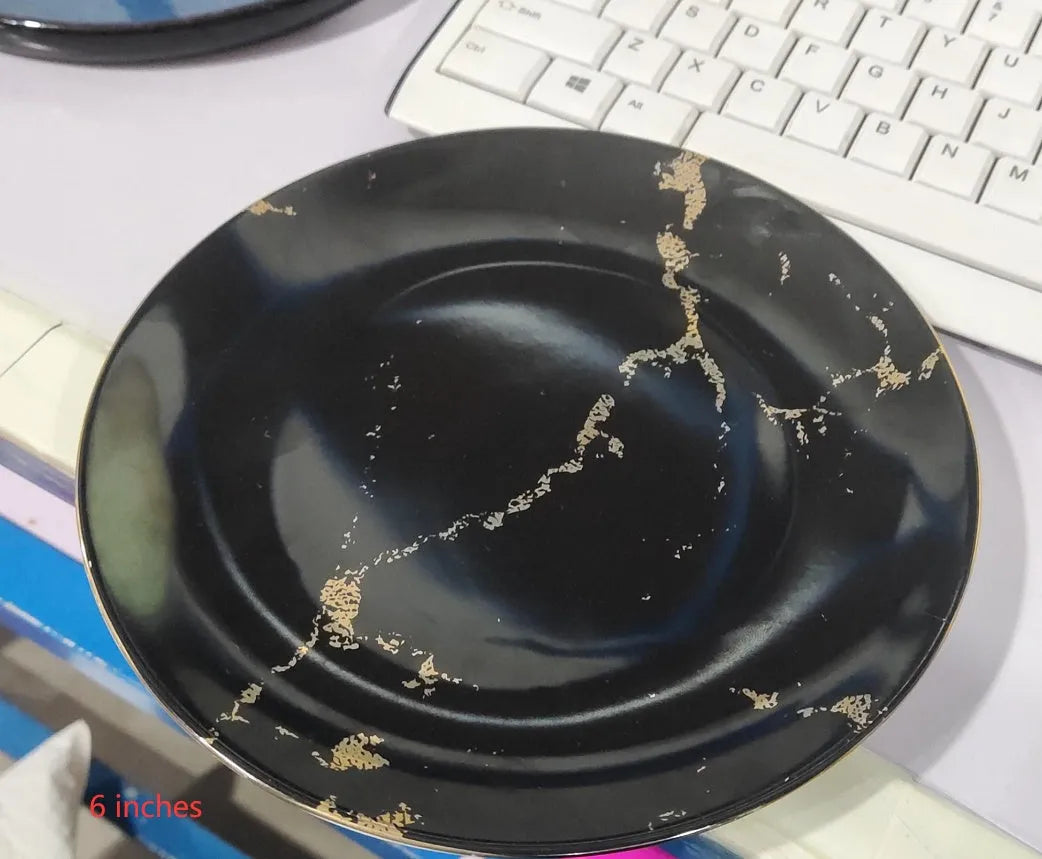 Ceramic Western steak plate with gold rim, 10-inch black option on a wooden table