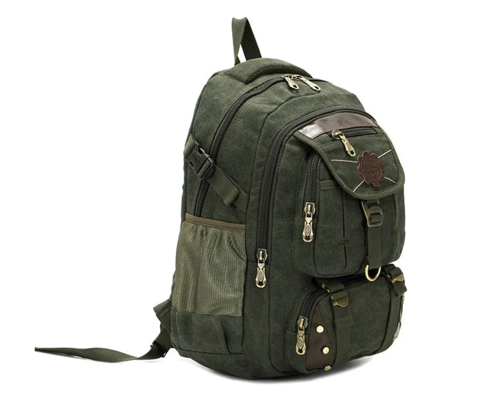 Large canvas computer backpack in military green with car stitching and top handle