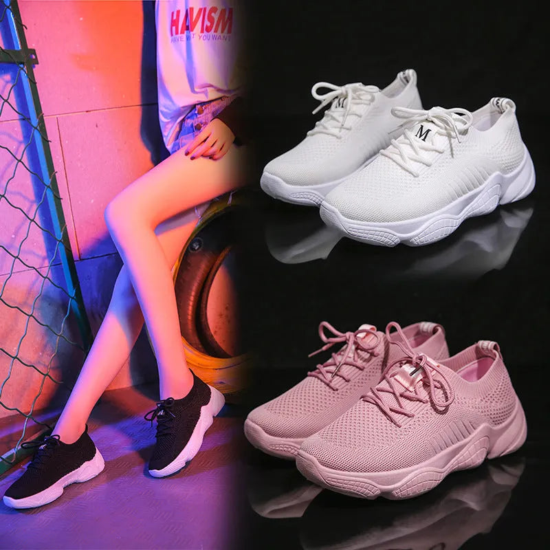 Women's white thick-soled casual sports shoes with woven upper and front strap closure.