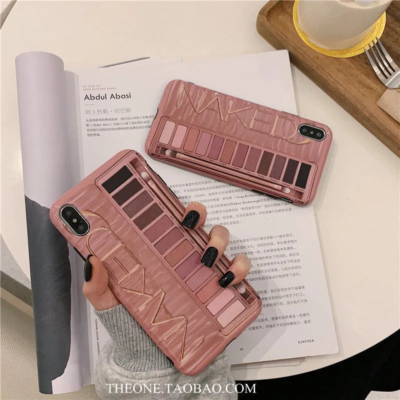 Flesh and grey silicone phone case for multiple iPhone models on a table.