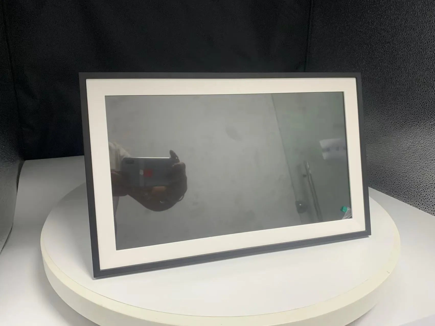 White 15.6 inch smart digital photo frame with app connectivity on wall mount