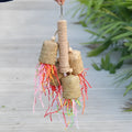 Wood and sisal shredded paper bird toy measuring 15 by 35 cm for parrot foraging enrichment