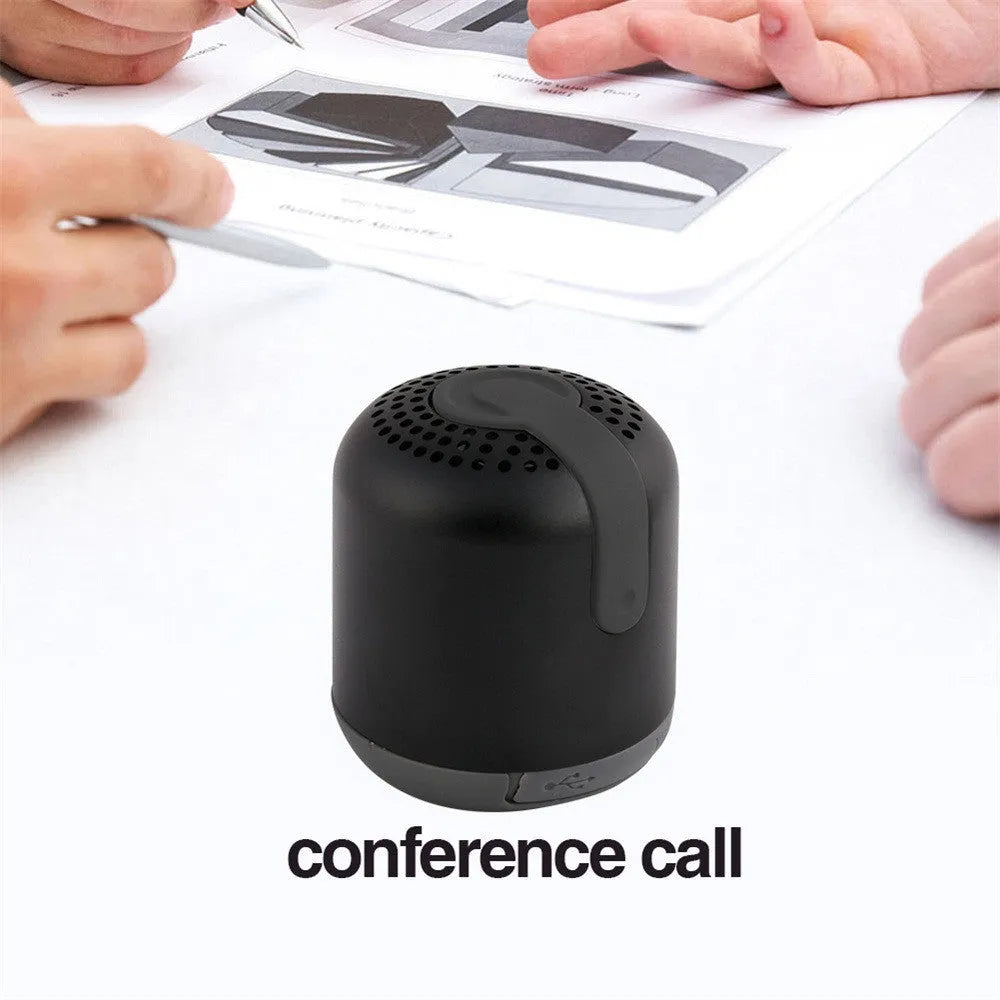 Hieha XQ11 cylindrical mini Bluetooth speaker in silver colour on a table