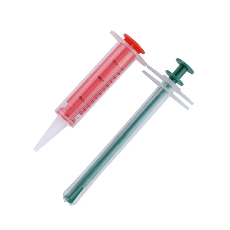Two pet pill shooters with soft silicone tips for cat and dog medication feeding
