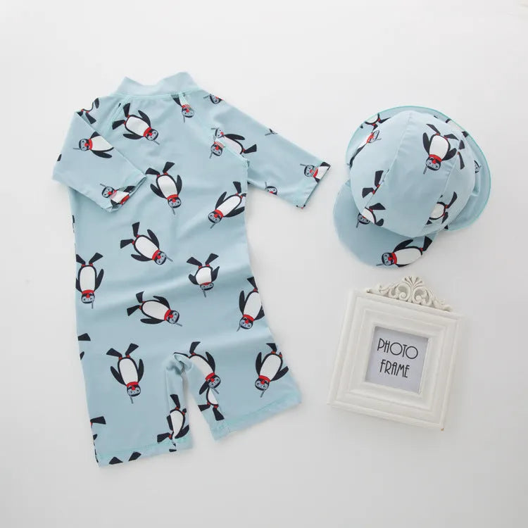 Boy's penguin themed long sleeve swimsuit with matching swimming cap for sun protection