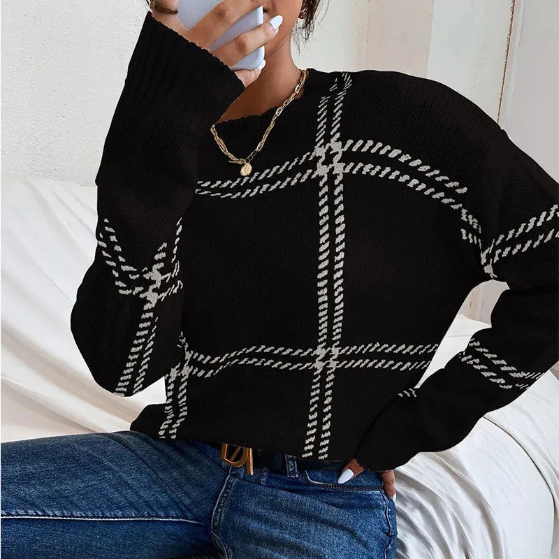 Women's loose-fit plaid colour-block acrylic sweater in apricot, black, beige, red, and green stripes.