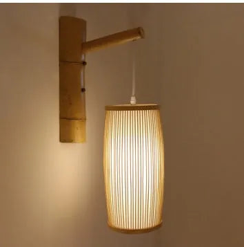 A woven bamboo plait lamp, 35cm tall, for hallway or staircase decoration