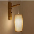 A woven bamboo plait lamp, 35cm tall, for hallway or staircase decoration