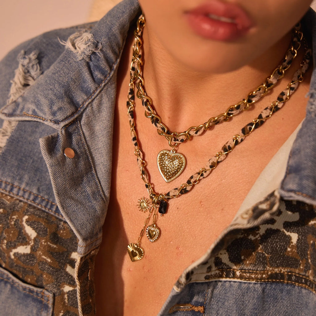 Stainless steel necklace with geometric leopard and heart pendant on adjustable chain