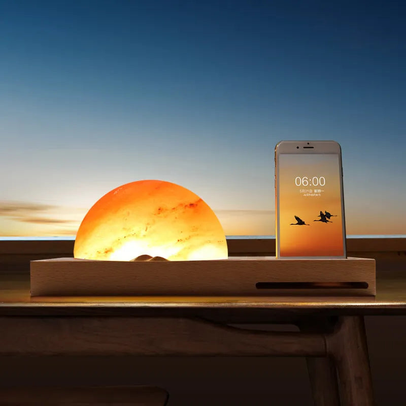 Sunrise Oriental wooden base table lamp with natural salt block shade and integrated wireless phone charging pad.