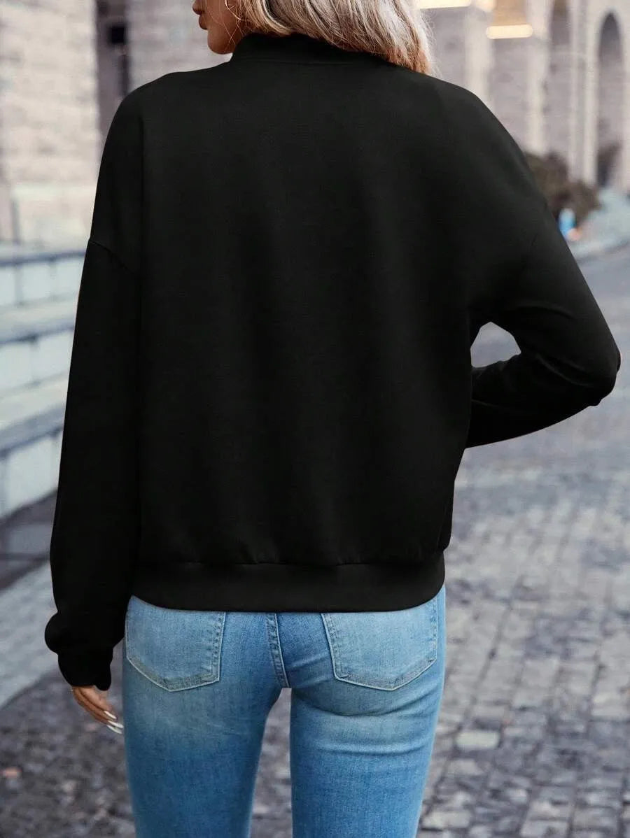 Black women's casual zip jacket with long sleeves and faux pockets on a model.