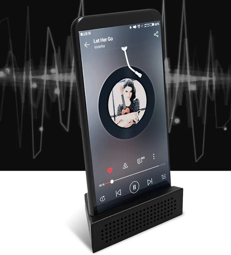 Portable black ABS plastic mobile phone amplifier bracket holding an iPhone in horizontal position.
