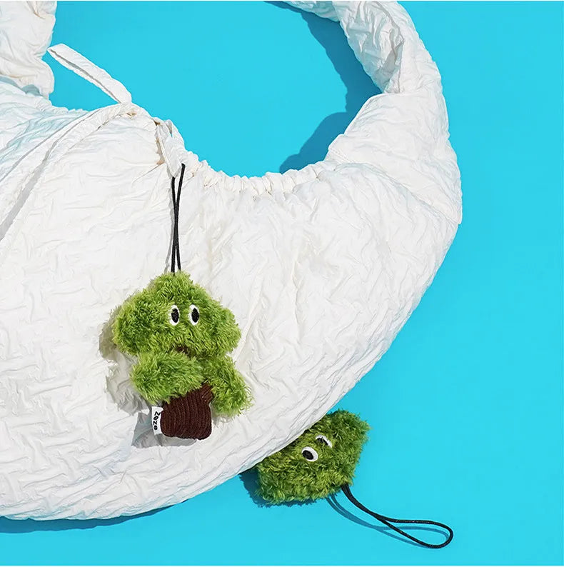 Pine tree shaped cat chew toy with fabric detail in three size options for feline dental enrichment