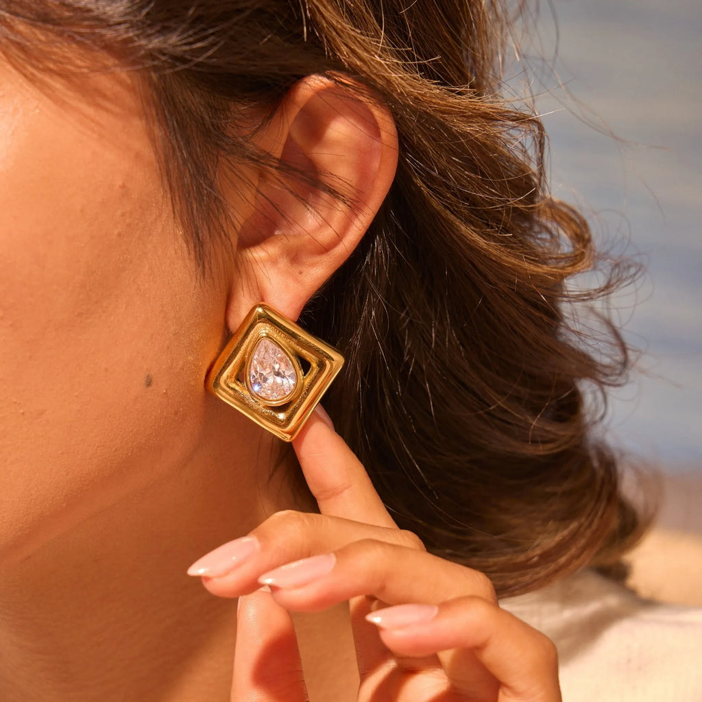Gold geometric stud earrings with water drop zircon inlaid detail on stainless steel